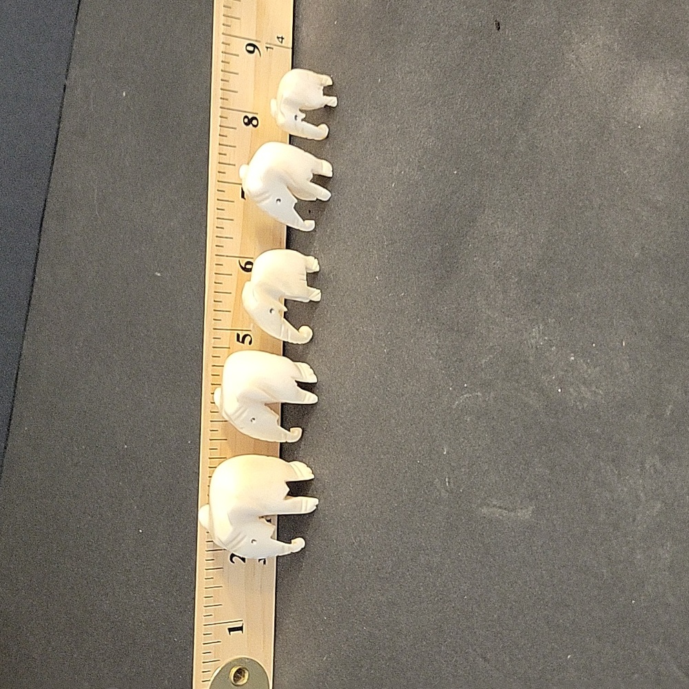 5 ivory elephants